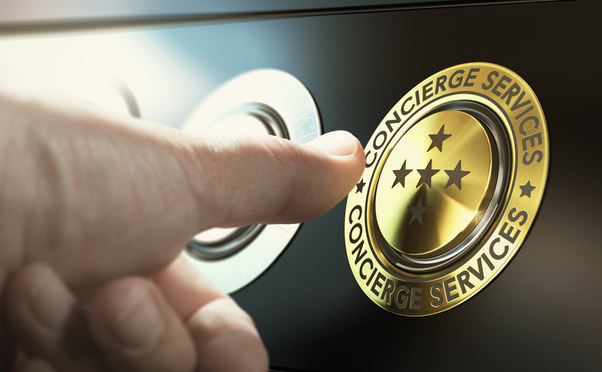 Man is contacting the concierge service by pushing a golden button - CONCIERGE SERVICES
